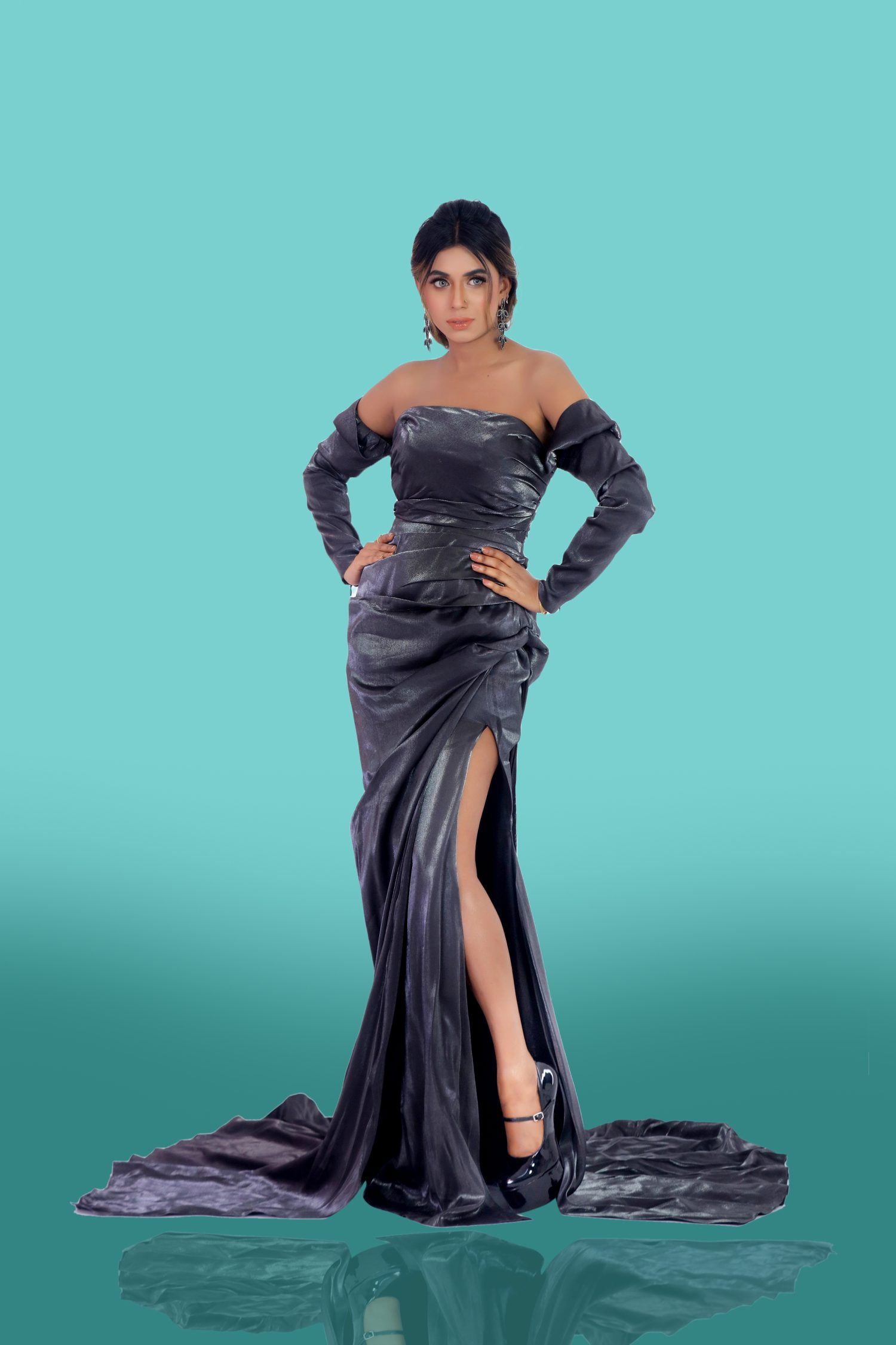 Black Shiny Taffeta Gown In the realm of evening wear, the black shiny taffeta gown stands as a paragon of sophistication. It is not merely a garment but a canvas where the artistry of design meets the poetry of fashion. This gown, a creation of Devon Couture by Jannat Akhi, is a testament to the designer’s commitment to elegance and luxury. Off Shoulder and Full Sleeve The off-shoulder neckline of this gown is a bold statement of allure, a design choice that speaks to the confident woman who wears it. The full sleeves add a touch of drama, billowing gracefully with every movement, reminiscent of the timeless elegance of a bygone era. Seamless Fit with Back Zipper The gown’s construction boasts a seamless fit, achieved through meticulous tailoring and a back zipper closure. This design choice ensures that the gown contours to the body’s natural lines, offering a silhouette that is both flattering and comfortable. Side Slit Design A side slit adds an element of intrigue, a subtle yet daring detail that allows for a glimpse of leg and a hint of the adventurous spirit within. It is a design that balances modesty with sensuality, a harmonious blend that is the hallmark of Devon Couture. Luminous Lineage, Devon Couture by Jannat Akhi Jannat Akhi’s vision for Devon Couture is one of uncompromising quality and innovative design. Each gown is a narrative of luxury, a story woven from the finest fabrics and adorned with the most exquisite details.